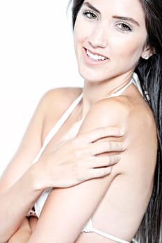 Beautiful sexy woman in white bikini smiling and cheerful