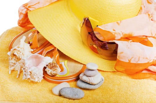 Beach  items a hat, a towel and slippers, it is isolated on white