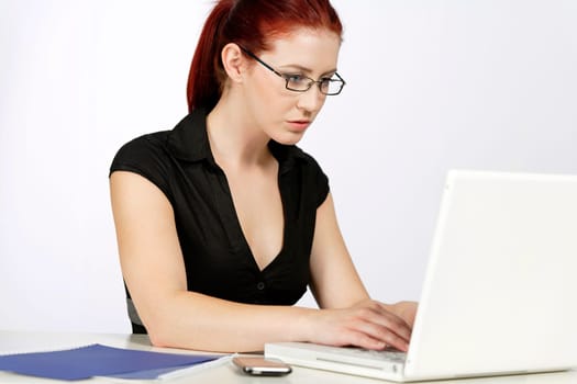Professional woman showing concern at work using her laptop