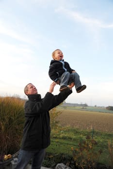 Family fun - father throws up child -