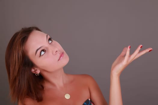 Young beautiful femail brown hair looking up