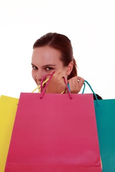 Young woman with colorful shopping bags isolated