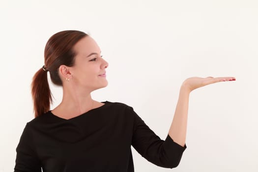 Young beautiful woman holding with flat hand