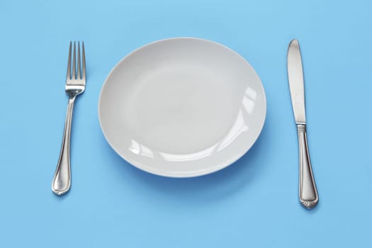 empty plate with fork and knife