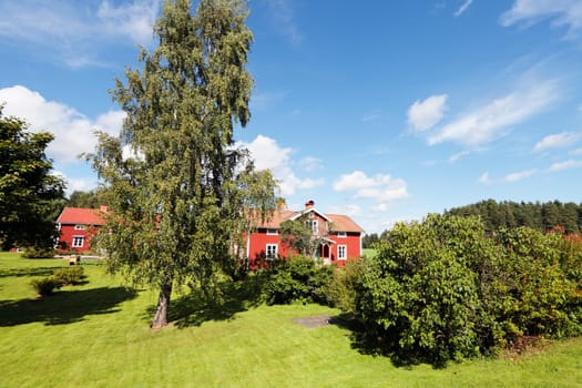 old red cottages, 16th century, typical swedish landscape scenery