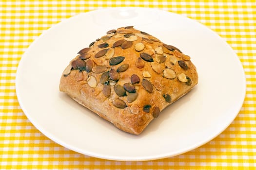 pipes pumpkin bread, presented on plate on tablecloth background