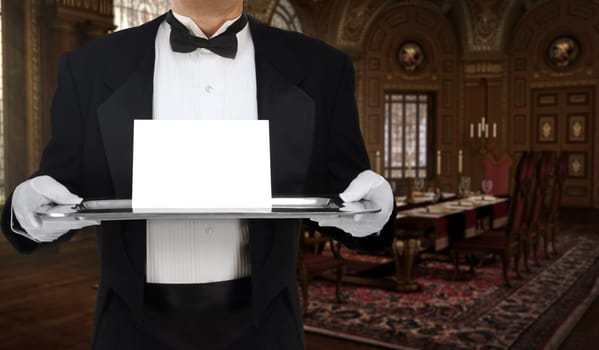 Butler in tuxedo tails holding a tray with an invitation on it in a grand, Boroque dining room