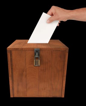 A man&#039 s hand putting an envelope in the slot of a box