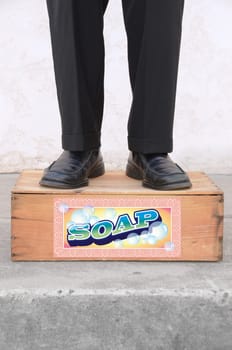 Man standing on a soap box