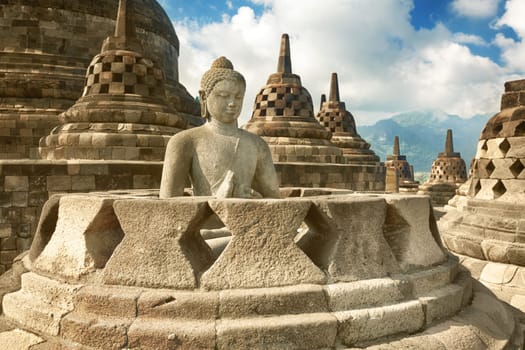 Buddha statue in stupa. Borobudur. Java. Indonesia