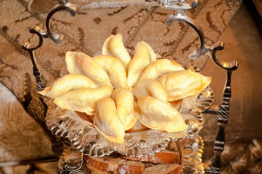 Moroccan patisserie cornes de gazelle in an elegant silver dish.