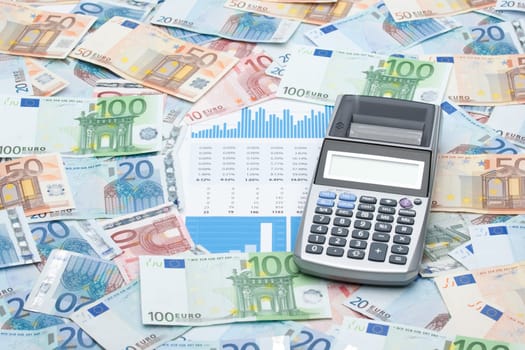 Calculator, money, graphs and sheets - building business (cash flow management) concept.