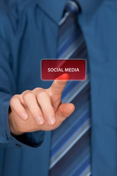 Social media concept. Mans hand click on social media button ahead. Selective focused hand.
