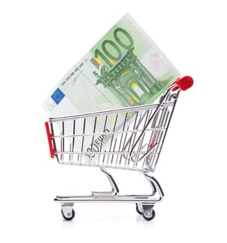 Spending money concept - shopping cart (shopping trolley) with money.
