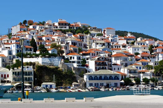 Skopelos, Greek . Hellenic island view from the port. Beautiful houses, sea, sun, view