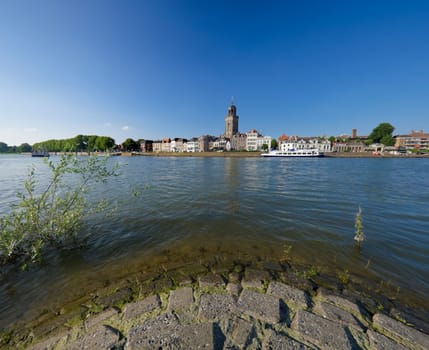 wide angle view on Deventer, Netherlands from the other side of the IJssel river. The church is the gothic Lebuïnus Church, build between 1450 and 1525.
