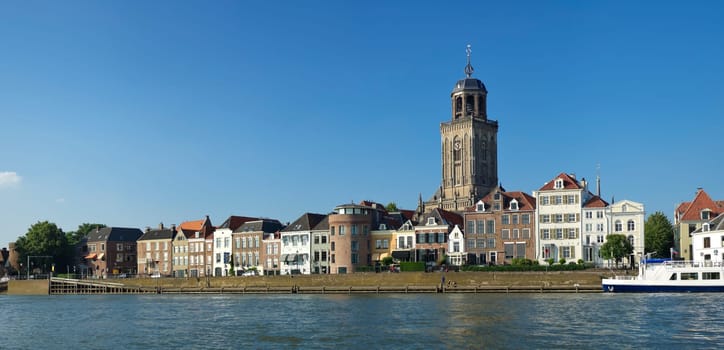 view on Deventer, Netherlands from the other side of the IJssel river. The church is the gothic Lebuïnus Church, build between 1450 and 1525.