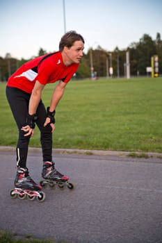 Sportsman on roller skates rest from tiring ride