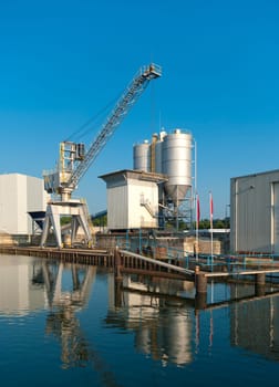 cement factory with crane and silos