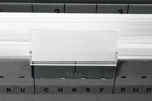 grey hanging file folder with blank label