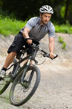 Mountain bikers in an inclined position on the downhill