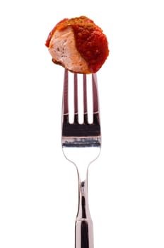 White cut-out fork with currywurst and curry sauce