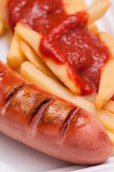 Fried red sausage and fries with ketchup
