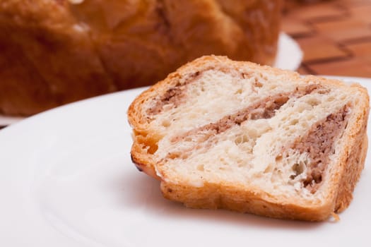 Close-up piece of nut cake on white plate