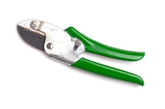Used secateurs with green handles on white background