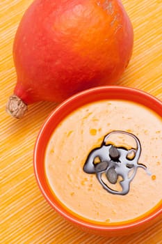 Pumpkin soup with pumpkin seed oil and pumpkin seeds