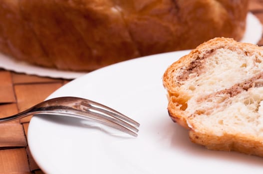 Fork and nut cake on a white plate