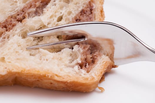 Fork and nut cake as a close-up