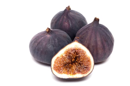 Ripe figs on white background