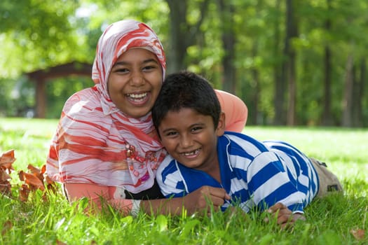 Outdoor portrait of indian brother and sister