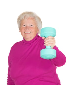 Cheerful senior woman lifting weights holding up a dumbbell in her flexed arm in a health and fitness concept