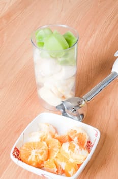 Preparing healthy smoothie drink from fresh fruits