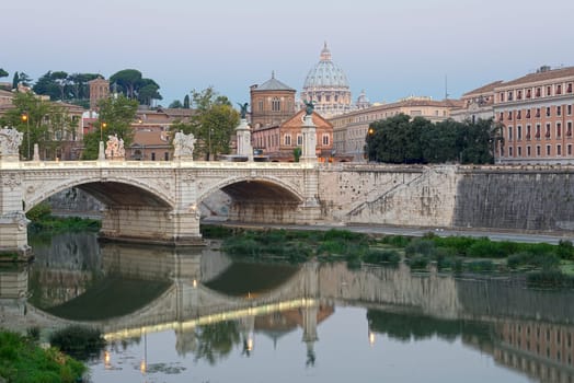 Beautiful image of the Tevere, the basilica and the bridge
