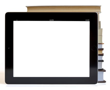 Books and tablet computer isolated on white, digital library concept,