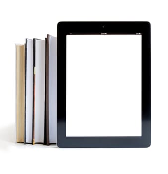 Books and iPad like tablet computer isolated on white, digital library concept,
