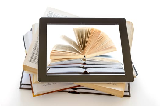 Books and iPad like tablet computer isolated on white, digital library concept,