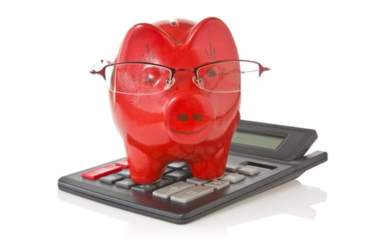 calculator and piggy-bank with glasses  on white background
