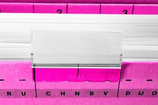 pink hanging file folder with blank label