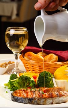 Delicious salmon grilled with brocoli lemon and bread