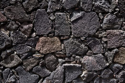 Lanzarote lava stone black masonry wall in Canary Islands