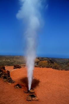 Geyser of steam in Timanfaya National Park Lanzarote at Canary Islands