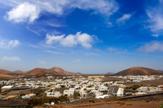 Lanzarote Yaiza white houses village under volcanic mountains of Canary Islands