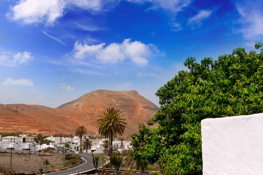 Lanzarote Yaiza white houses village under volcanic mountains of Canary Islands