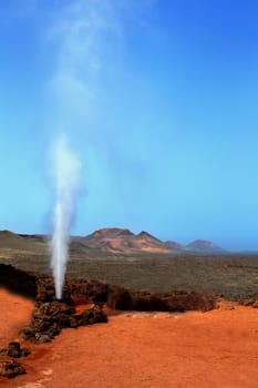 Geyser of steam in Timanfaya National Park Lanzarote at Canary Islands