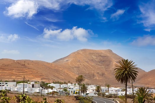Lanzarote Yaiza white houses village under volcanic mountains of Canary Islands