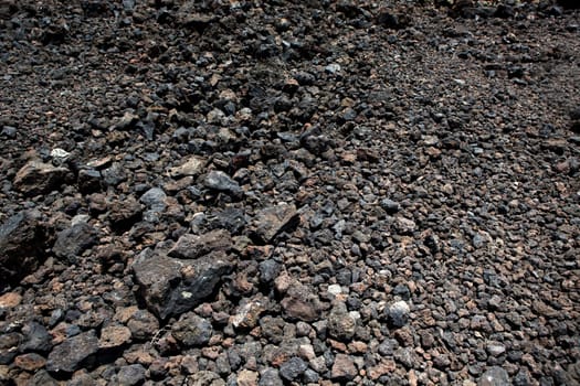 Black volcanic stones soil texture in Lanzarote